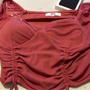 A pink flowy shirt size xxl fits like a large still has tags